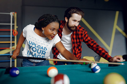 Mockup of a Woman with a Basic Tee Playing Pool with a Friend
