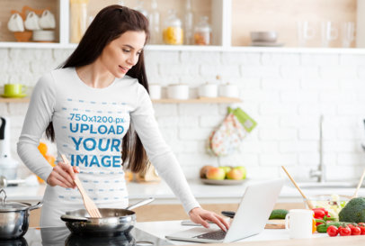 Long-Sleeve Tee Mockup of a Woman Looking at Her Laptop