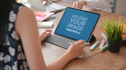 Mockup of a Woman Working on an iPad with Keyboard 36923-r-el2