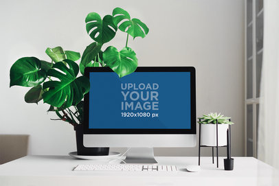 Mockup of an iMac Placed on a Minimalistic Table by a Houseplant 36572-r-el2
