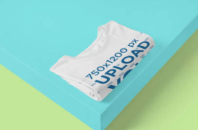 Mockup Featuring a Folded Customizable T-Shirt in a Minimal Setting 