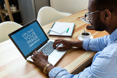 MacBook Pro Mockup of a Man Working from Home