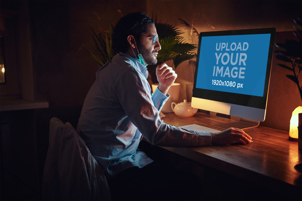 iMac Mockup of a Man Working from Home