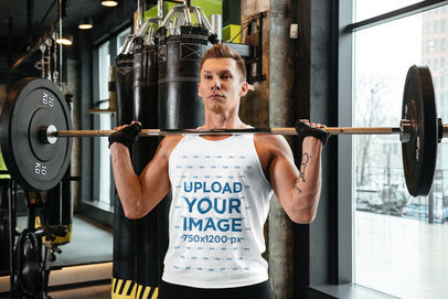 Tank Top Mockup of a Man Doing an Overhead Press 