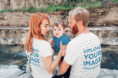 Back View T-Shirt Mockup Featuring a Couple with Their Baby