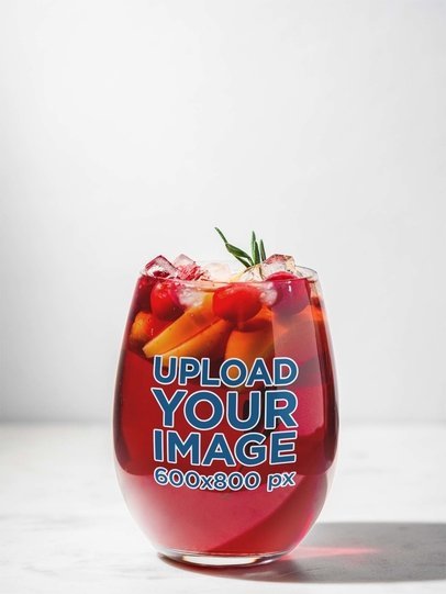 Mockup of a Stemless Wine Glass Filled with a Drink of Tropical Fruits