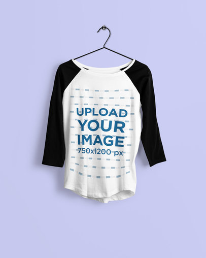 Mockup Featuring a Raglan Three-Quarter Sleeve Tee Hanging Against a Colored Backdrop 4373-el1