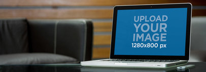 MacBook Pro Mockup Featuring a Glass Table 