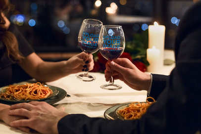 Wine Glass Mockup of a Couple Having Dinner at a Restaurant
