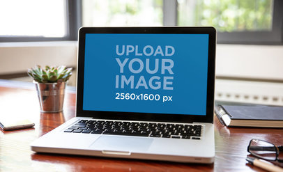 Digital Mockup of a MacBook on a Home Office Desk