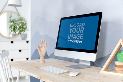 Mockup of an iMac Placed on a Minimalist Wooden Desk 
