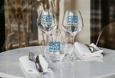 Mockup of Three Wine Glasses on a Restaurant's Table 36448-r-el2