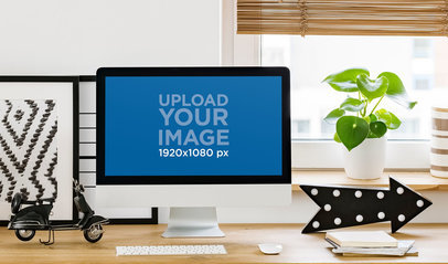 Mockup of an iMac Featuring a Cozy Home Office Workspace
