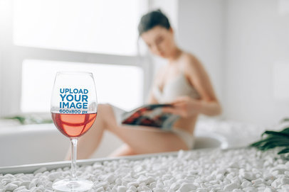 Wine Glass Mockup Featuring a Woman in the Background