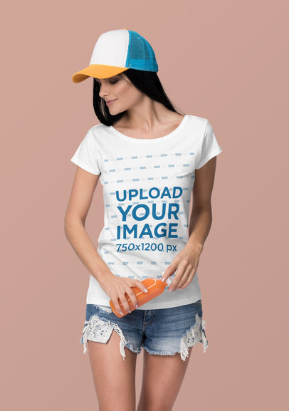 T-Shirt Mockup Featuring a Woman Holding a Bottled Juice at a Studio 4365-el1