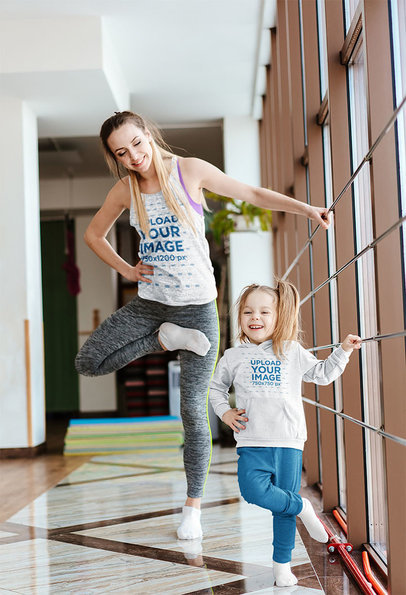 Mockup of a Mom with a Tank Top and a Girl with a Hoodie Practicing Ballet