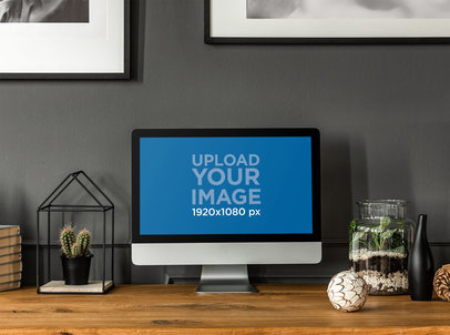 Mockup of an iMac Placed on a Wooden Desk by Indoor Plants