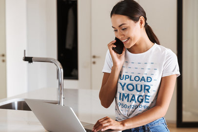 Tee Mockup of a Young Woman Working from Home
