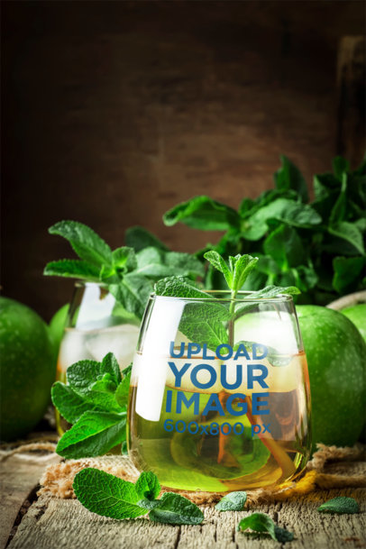 Stemless Wine Glass Mockup Featuring a Drink with Mint Leaves
