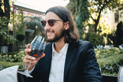 Wine Glass Mockup Featuring a Stylish Man at a Restaurant 36576-r-el2