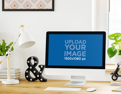 Mockup of an iMac Surrounded by Desk Decor Items 36557-r-el2