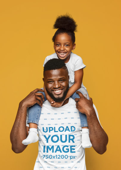 T-Shirt Mockup of a Father Carrying His Daughter on His Shoulders at a Studio
