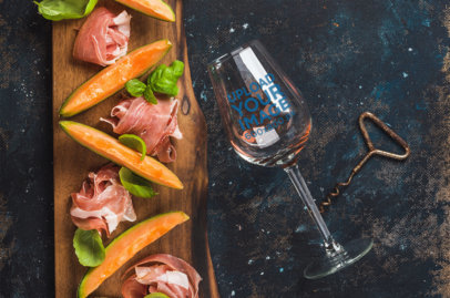 Mockup of a Wine Glass Next to a Charcuterie Board 36827-r-el2