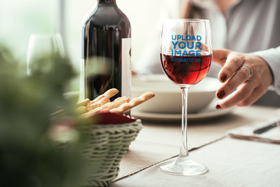 Mockup of a Wine Glass on a Dinner Table 36731-r-el2