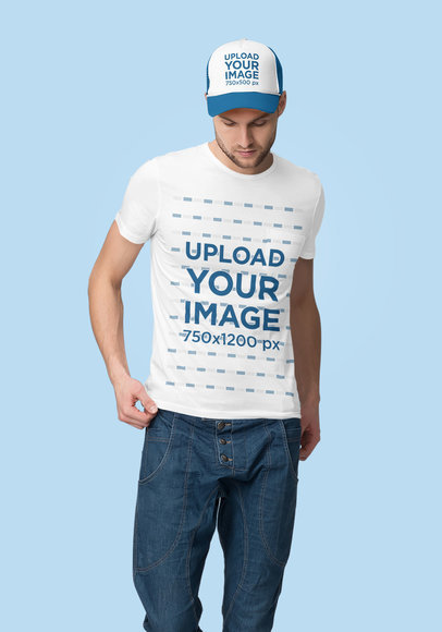 T-Shirt Mockup of a Young Man Posing in a Studio