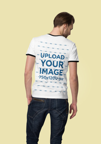 Back View Mockup of a Man Wearing a Ringer T-Shirt Against a Solid Color Backdrop
