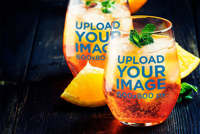 Mockup of Two Stemless Wine Glasses Filled with Tropical Drinks