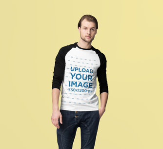 Mockup of a Man Wearing a Long Sleeve Raglan Tee Against a Plain Background 