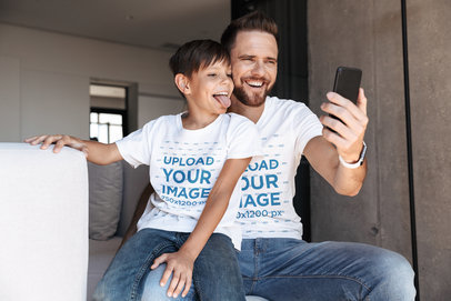 T-Shirt Mockup Featuring a Dad and Son Taking a Selfie