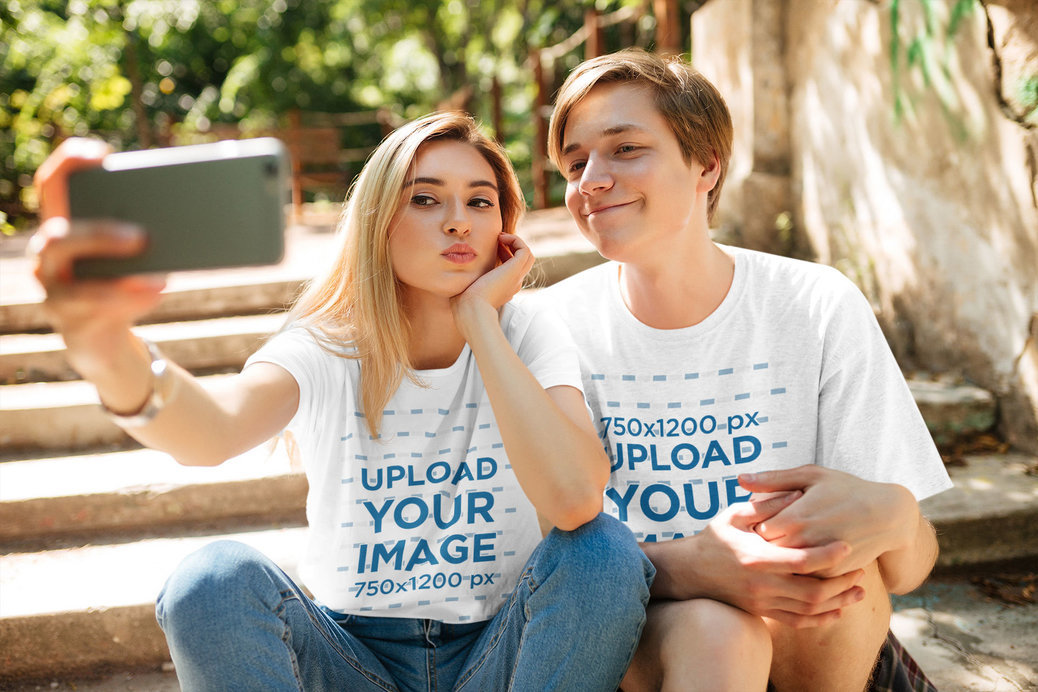 T-Shirt Mockup Featuring Two Young Friends Taking a Selfie