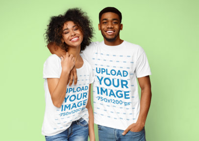 T-Shirt Mockup of a Happy Young Couple Posing at a Studio