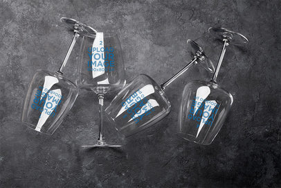 Mockup of Four Wine Glasses Lying on a Dark Stone Surface 36787-r-el2