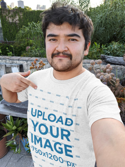 Selfie Mockup of a Man Pointing at His Heathered T-Shirt 
