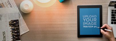 Mockup Featuring a Man Working on His iPad 