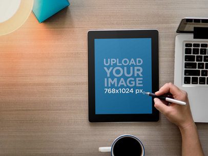 Mockup of a Man Using His iPad at Work 