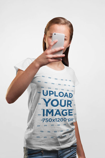T-Shirt Mockup of a Woman Taking a Mirror Selfie