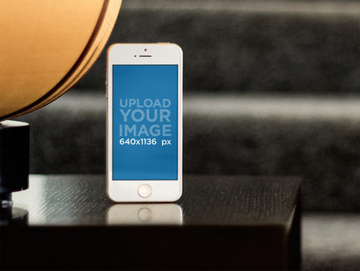 Apple iPhone 5s Gold Portrait Stand Out On Coffee Table