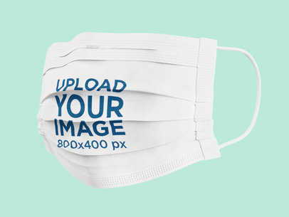 Mockup of a Disposable Face Mask Against a Plain Color Backdrop 4580-el1