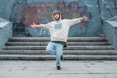 Mockup of a Man with an Oversized Hoodie Posing at an Urban Setting 36973-r-el2