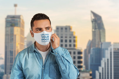 Face Mask Mockup Featuring a Man Against a City Background 