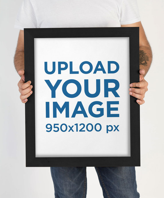 Mockup of a Tattooed Man Holding a Framed Art Print  