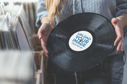 Mockup of a Long-Haired Woman Holding a Vinyl Record at a Store 36720-r-el2