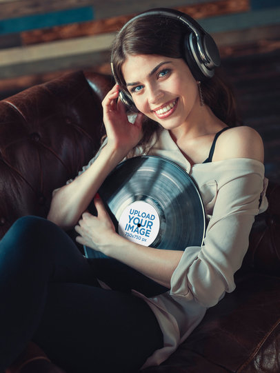 Mockup of a Smiling Woman Holding a Vinyl Record 