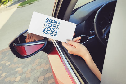 Mockup of a Woman Receiving a Flyer Through the Window of Her Car