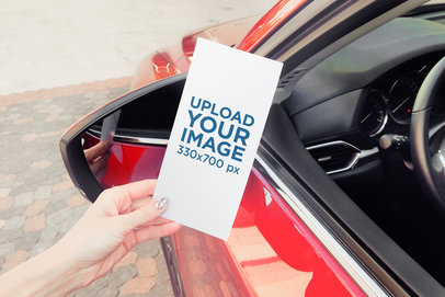 Mockup of a Woman Reading a Flyer Next to Her Car