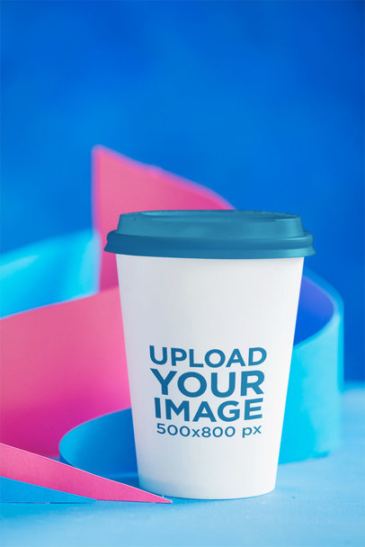 Mockup Featuring a Coffee Cup With a Customizable Color Lid 